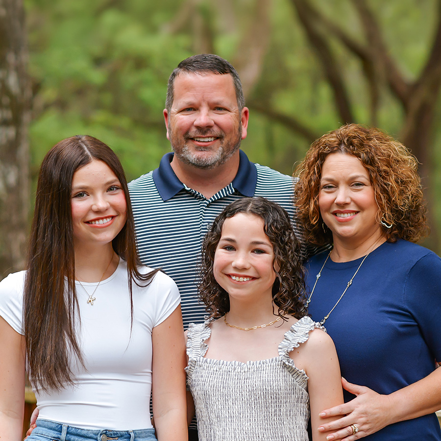 CJ Thompson with daughters and wife