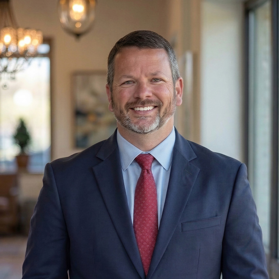 CJ Thompson in a suit and tie